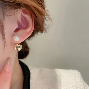 Elegant gold plated pearl and metal ball earrings for women in a minimalist modern style