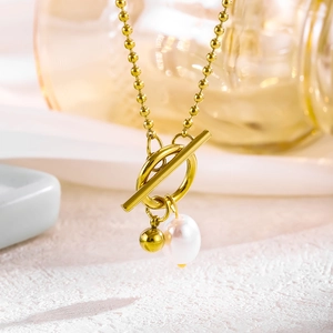 18k gold plated titanium necklace with small golden beads and white pearl pendant