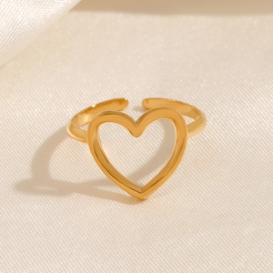 Polished hollow heart open ring in 18K gold plated stainless steel on white silk