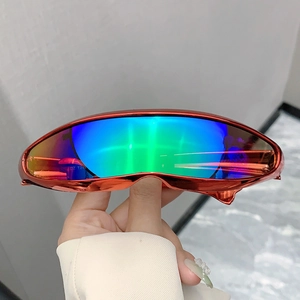 Detail of Y2K futuristic wrap-around cycling sunglasses with orange metallic finish