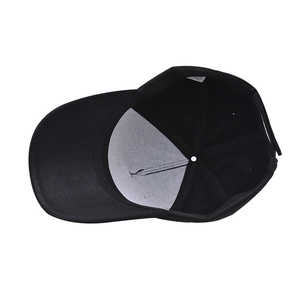 Detail view of the black baseball cap interior with stitching and care label