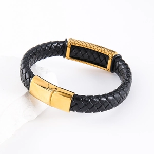 Braided black leather bracelet for men with a golden magnetic clasp on white stone