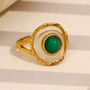Detail of 18K gold plated ring with green acrylic stone and hammered metal texture