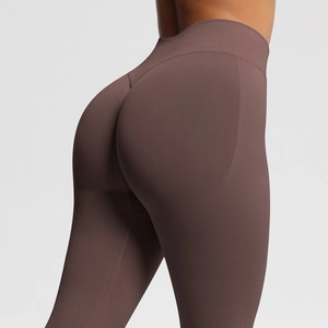 Detail view of high waist seam compression fabric and peach butt lift of yoga leggings