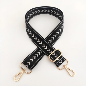 Adjustable black and white arrow pattern woven nylon shoulder strap with gold metal hooks