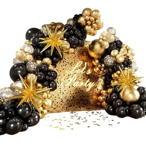 Elegant black and gold balloon arch kit with star foil balloons and sequin backdrop
