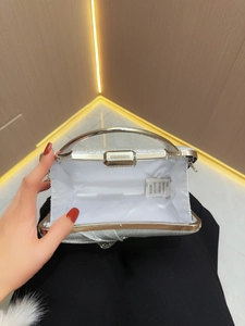 Elegant silver sequin evening clutch bag with metal ring handle and crystal sparkle finish