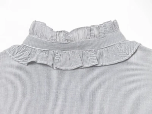 Detailed close-up of double-layered ruffled stand collar with vertical stripes