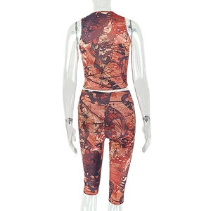 Back view of two-piece orange and brown sleeveless top and cropped pants set