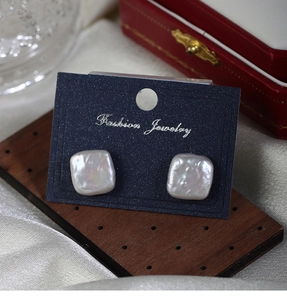 Detail of square baroque freshwater pearls with natural luster on a display stand