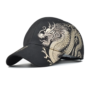 Black cotton baseball cap featuring gold dragon print and side lettering details