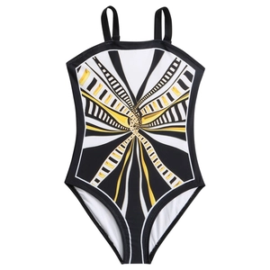 Girls one-piece swimsuit featuring black and white geometric patterns with gold accents