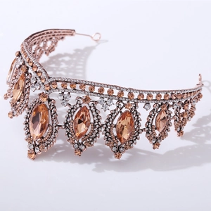 Macro detail of Baroque bridal crown featuring amber crystals and bronze vintage filigree