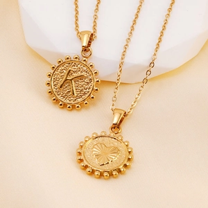 18K gold plated stainless steel letter K and heart pendant necklace with wavy edge texture