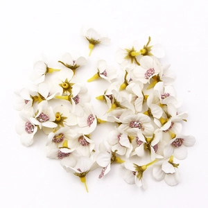 Mini white silk daisy flower heads with pink centers for DIY wedding crafts and home decor