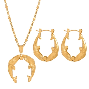 Luxury gold titanium steel jewelry set featuring dolphin pendant necklace and earrings