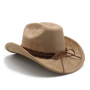 Detail of tan suede cowboy hat featuring woven leather band and classic wide brim