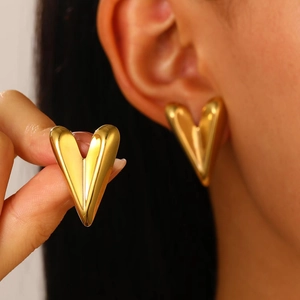 Minimalist golden heart-shaped V earrings with polished high-shine metallic finish