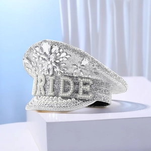 Close-up of sparkling silver sequins and pearl BRIDE lettering on a luxury bridal captain hat