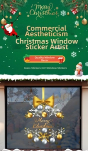 Detail of Christmas wreath window sticker with gold Merry Christmas lettering and snowflakes