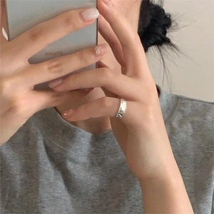 Minimalist S925 sterling silver ring with irregular hammered texture on a finger