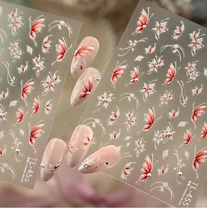 Detail of TL-455 nail art stickers featuring red butterflies and white floral patterns