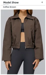Detail of coffee brown windproof sports jacket featuring zipper and elastic hem