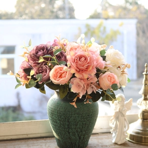 European vintage silk rose bouquet in a green cracked ceramic vase for home decor