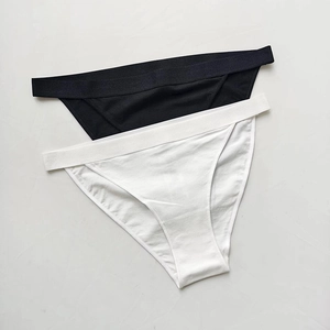 Flat lay detail of black and white breathable cotton panties with soft knitted texture