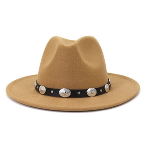 Close-up of camel wool felt fedora featuring a vintage belt with metal stud details