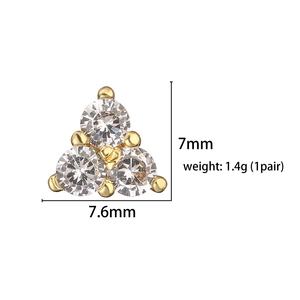 Macro view of gold triangular stud earring with clear zircon and dimensions 7.6mm x 7mm