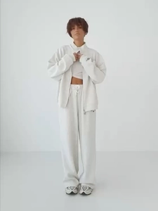 Full view of cream-white street style hooded tracksuit with zipper jacket and wide-leg pants