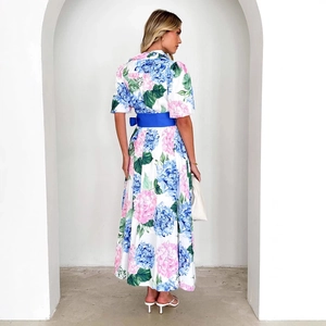 Floral print bohemian maxi dress with short sleeves and a bright blue waist belt