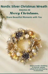 Close-up of Nordic silver Christmas wreath with LED warm lights and pine cones