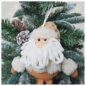Knitted Santa plush ornament with white hanging rope on a festive Christmas tree branch