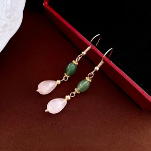 Elegant gold drop earrings featuring green jade beads and pink quartz waterdrop pendants