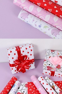 Detail of assorted gift wrapping paper with heart, swan and sea animal patterns for occasions