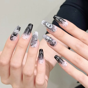 Dark Halloween press-on nails featuring silver spider relief and hand-painted webs