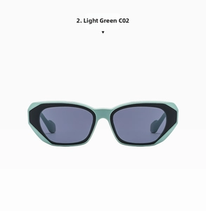 Detail view of light green cat eye sunglasses with grey UV protection lenses