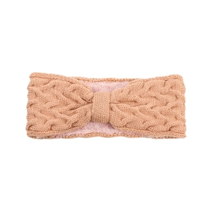 Detail of pink cable knit headband showing warm fleece lining and soft braided texture