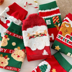 Combed cotton Christmas socks with festive cartoon designs in a cozy gift box presentation