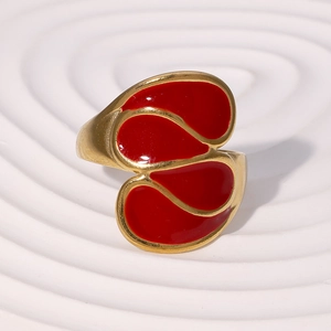 18k gold plated stainless steel ring with red enamel teardrop design on white tray