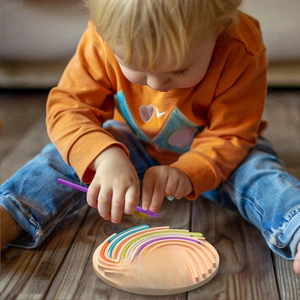 Detail of colorful silicone sensory activity board with stylus for kids tactile play
