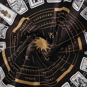 Bohemian tarot tapestry featuring golden zodiac wheel and celestial star designs on black fabric