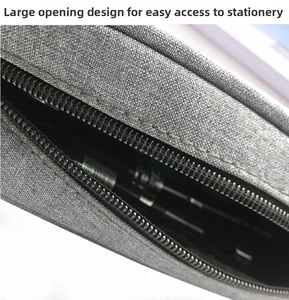 Detail of grey pencil case featuring a wide opening design and durable metal zipper
