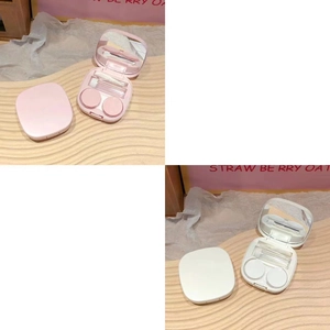 Pink and white contact lens case set with mirror, tweezers, and solution bottle