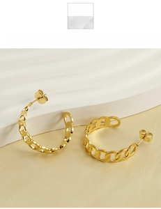 Macro shot of 18k gold plated stainless steel chain-link C-shaped stud earrings