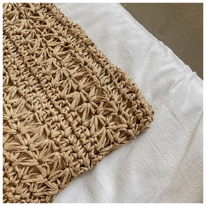 Macro shot of star-patterned woven fiber texture and soft fabric lining of the handbag