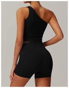 Rear view of black one-shoulder yoga vest and high-waist fitness shorts set