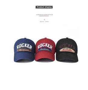 Detailed embroidery and vintage washed cotton texture on retro rocker baseball caps